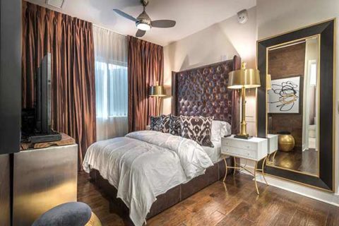 guest suite bedroom with hardwood-inspired flooring