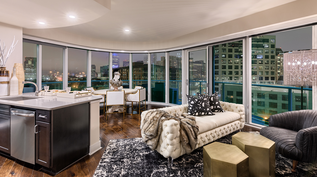 Living room with stunning views, hardwood flooring and floor to ceiling windows