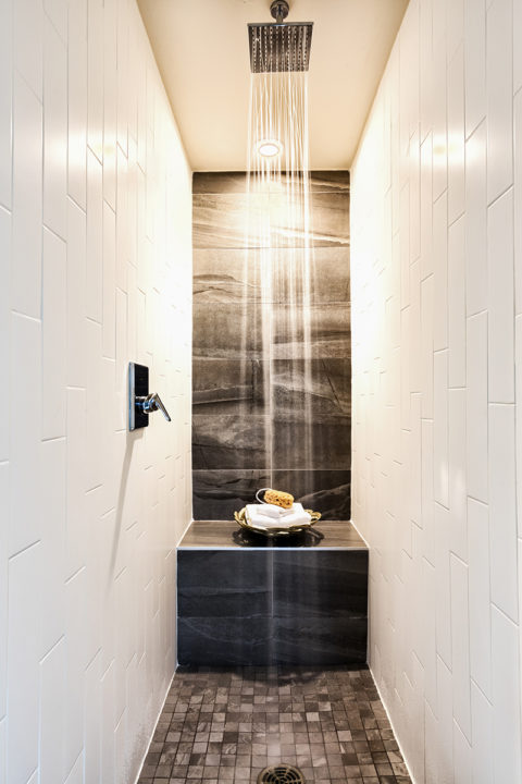 Stunning walk in shower with tile flooring